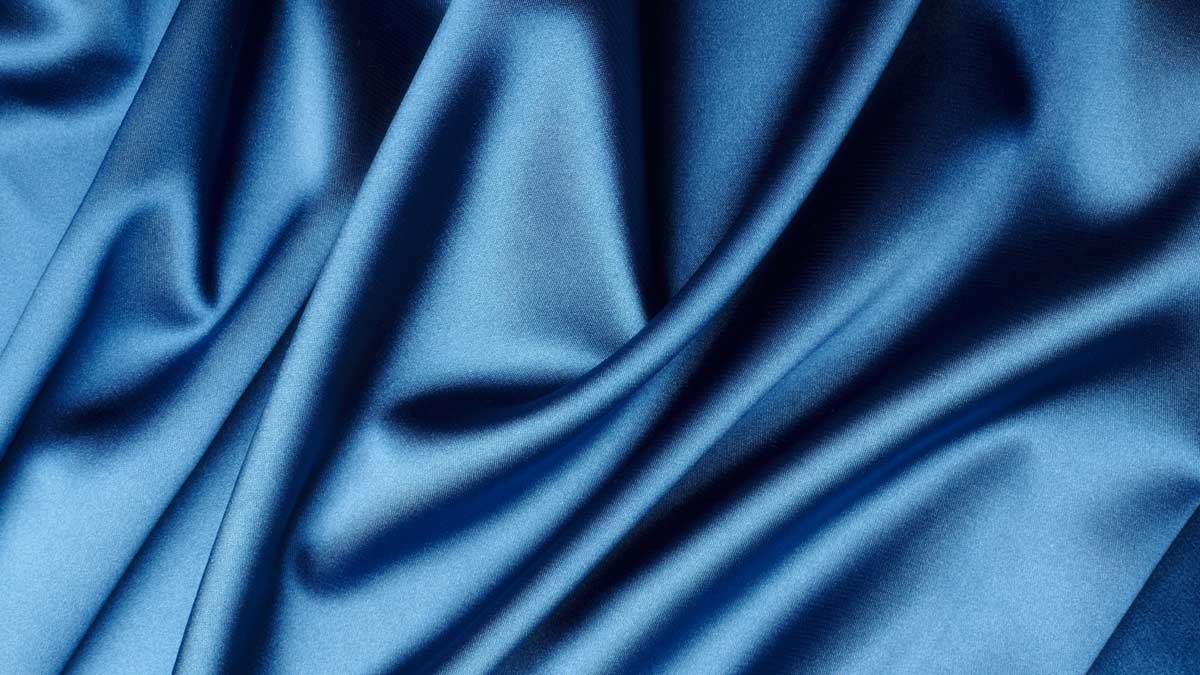 A close up of the blue fabric