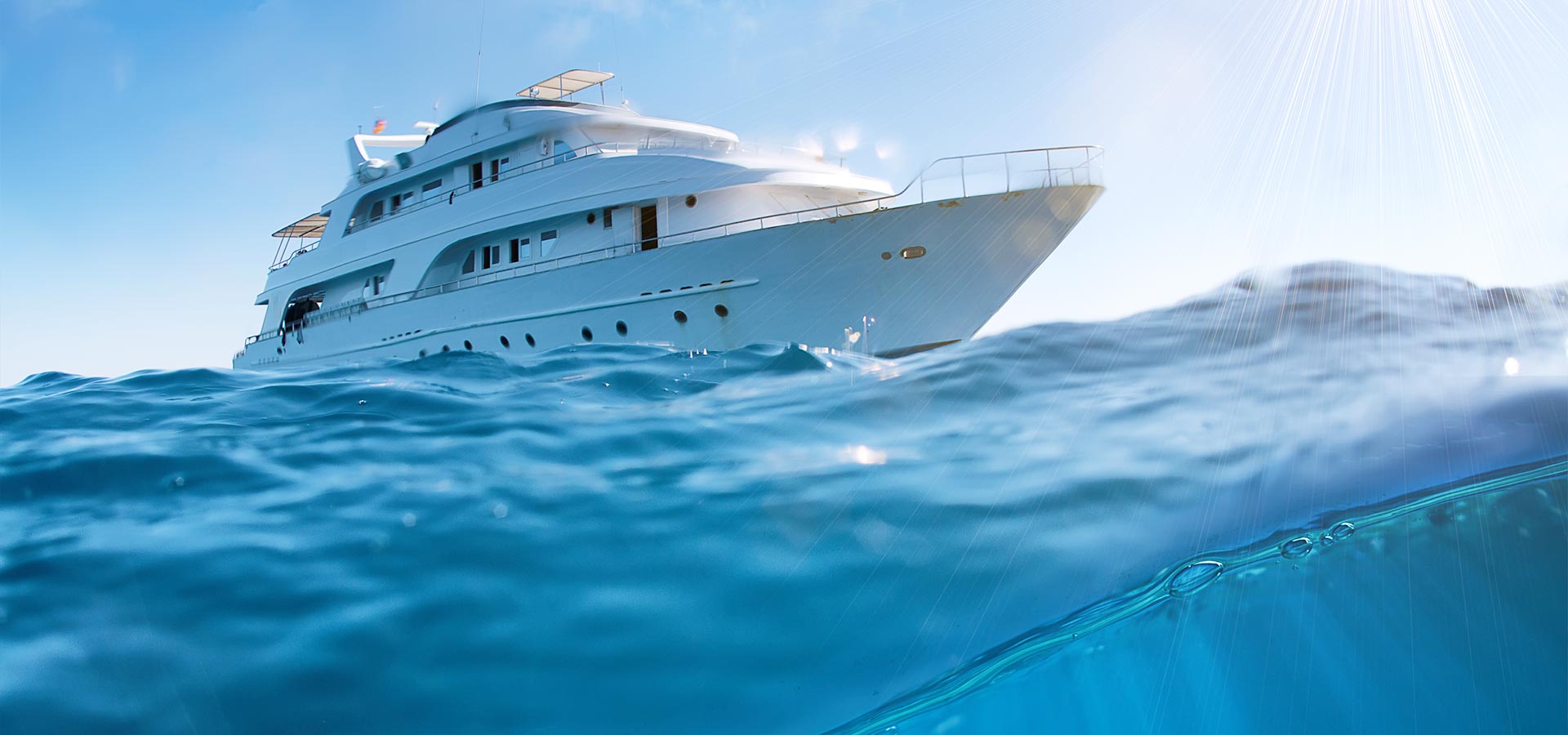 A large white boat floating on top of the ocean.